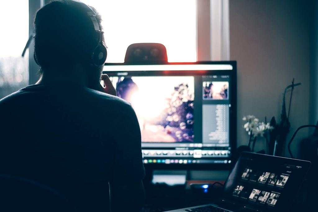 Team member assisting customer via headset in modern office environment