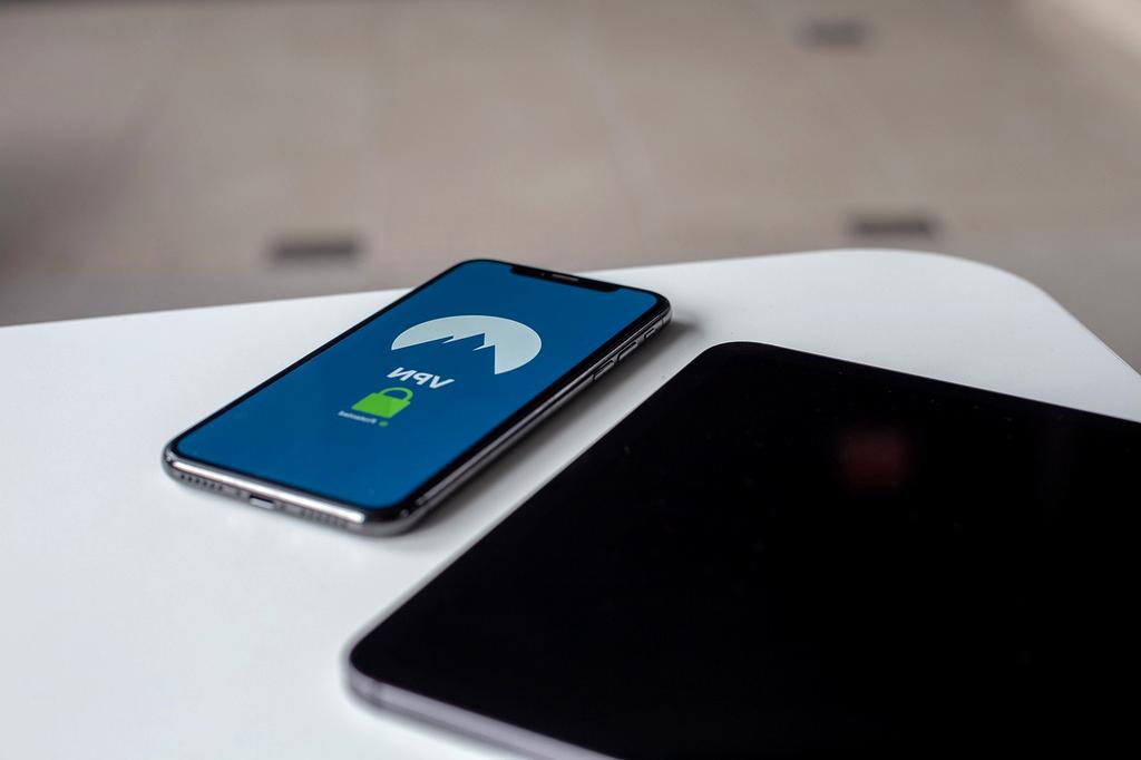 Assorted network tools and resources on desk with router