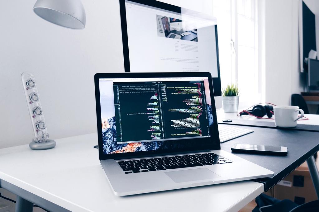 Security professional analyzing network vulnerabilities on laptop